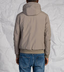 Giubbotto uomo in tessuto tecnico con cappuccio