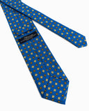 Cravatta uomo in seta fantasia geometrica azzurra e oro 3 pieghe